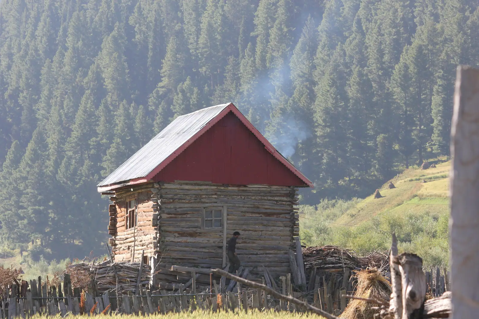 A traditional wooden house with a red roof in Gurez Valley