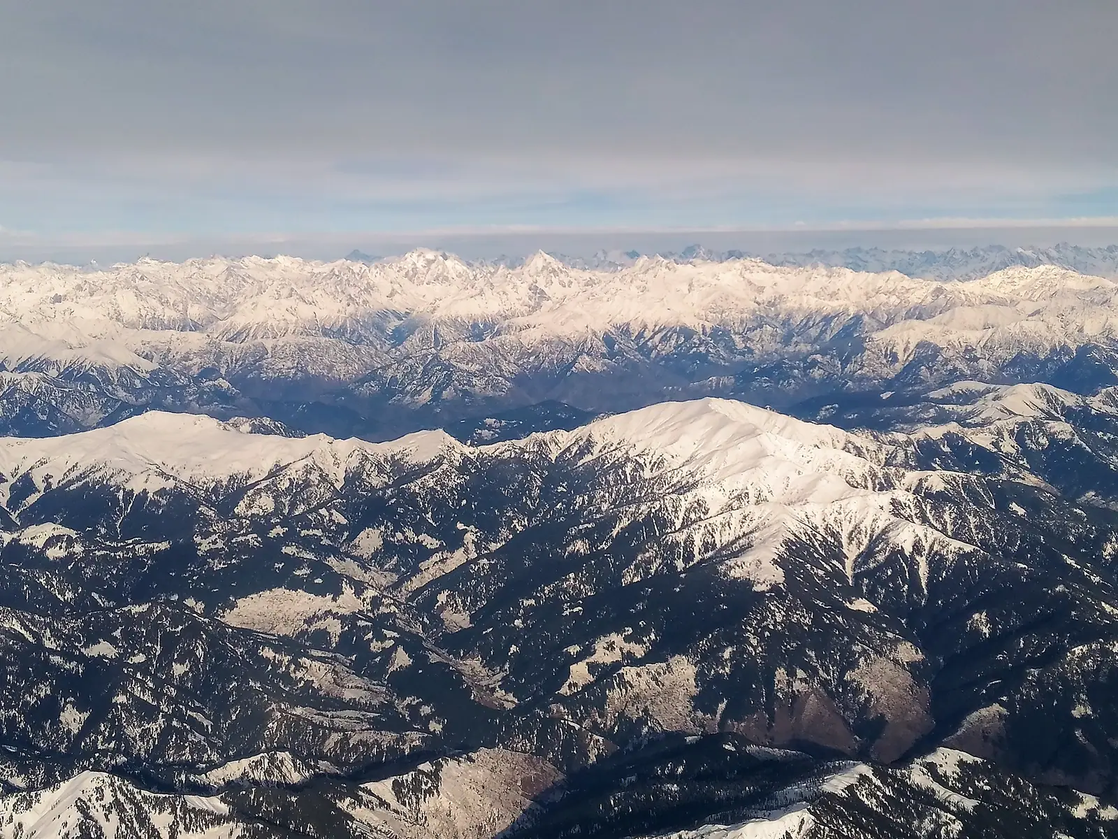 Aerial view of snow-clad Himalayan ranges over Kashmir